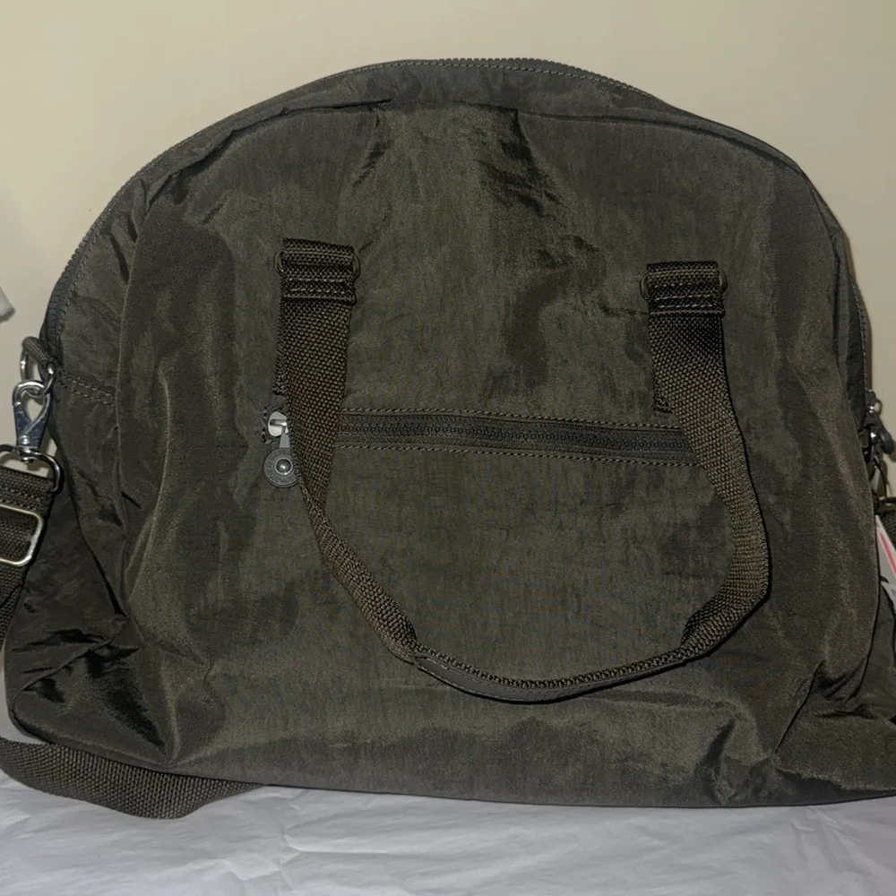 Kipling Black Duffel Bag, new, outside pockets, inside pockets, unisex